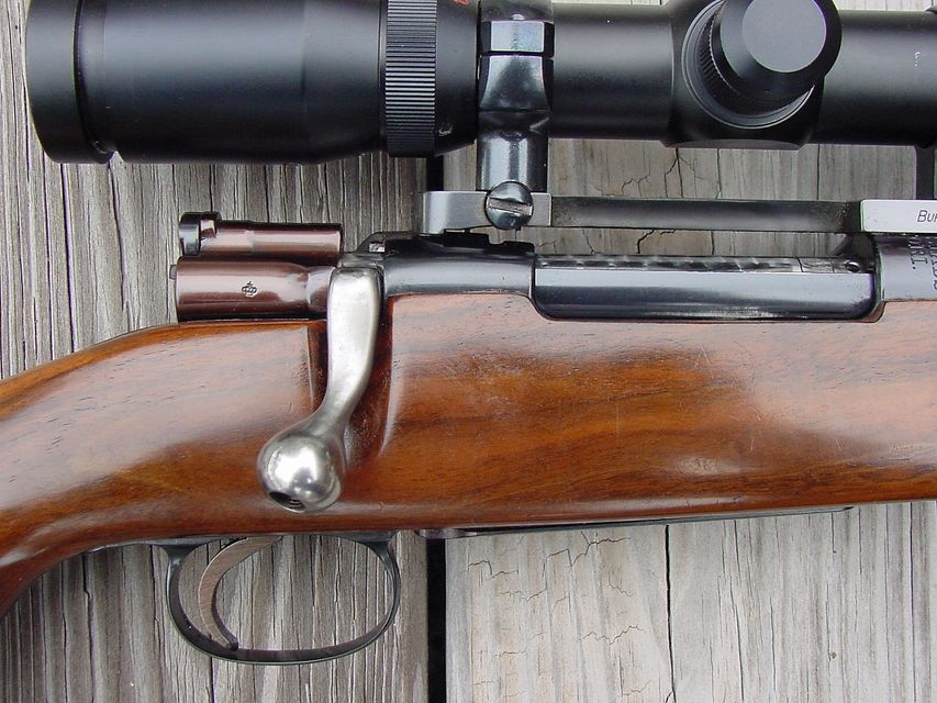 Click to view full size image
 ============== 
Model 96 Swede Right Side of Action Close
These are the modifications to the bolt as mentioned. Note the removal of the cocking knob at the rear of the bolt, the new scope safety, flat bolt handle, shaped knob and the angle that the bolt is swept back. The Timney trigger has been shortened and the tip rounded. In the photo you can also see that the rounded ridge behind the stripper clip opeaning has been removed. The bolt body has been polished to 500 grit and jewled or engine turned. The extractor has been blued but should be left polished as it will scratch when the bolt is worked.
