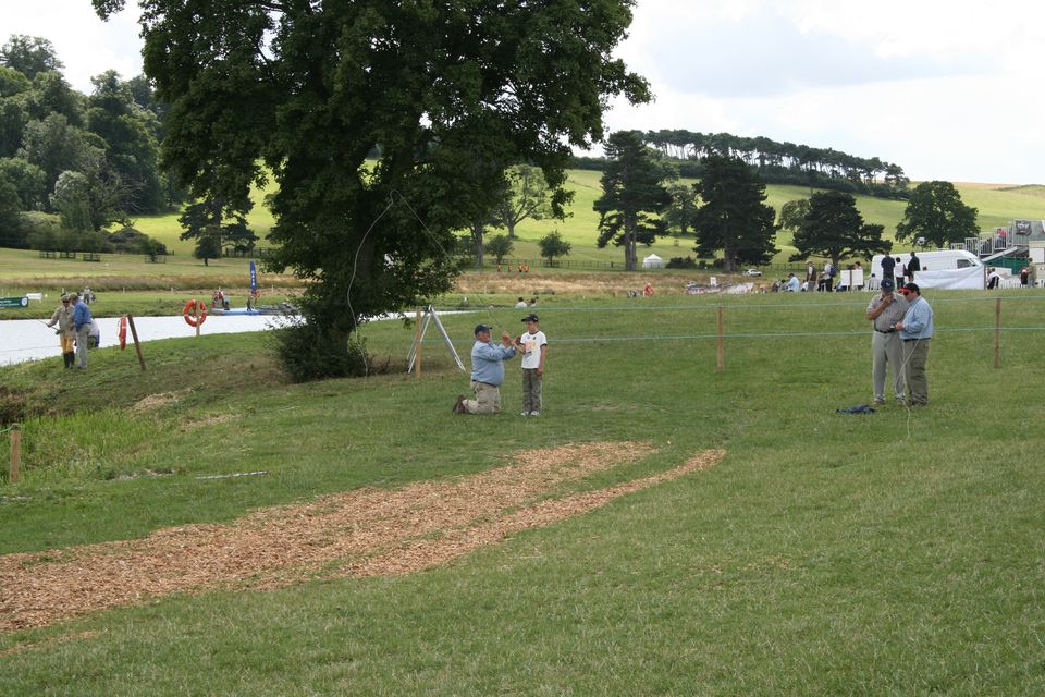 Click to view full size image
 ============== 
CLA game fair, 2009
Teaching my boy how to cast.  Every year we have country fairs and the CLA is the biggest.  Gunmakers row is a mile long and has it's own pub in the middle.  A good weekend away.
